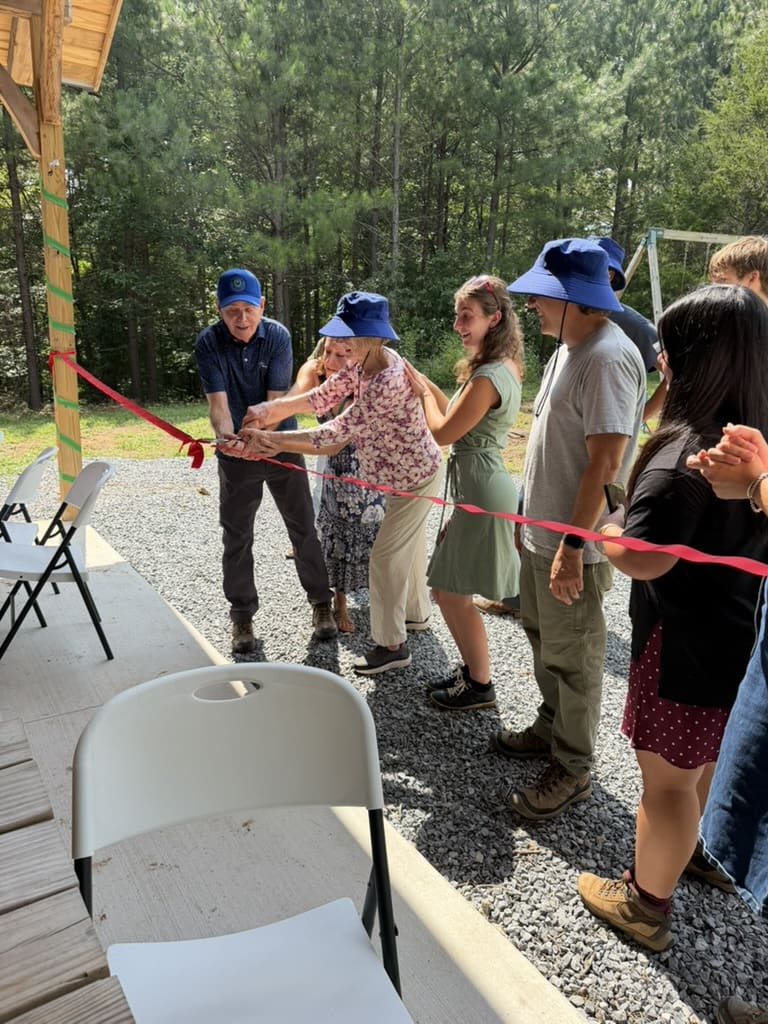 Cutting the ribbon at the pavilion opening